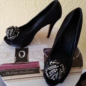 Black satin heel by Steve Madden